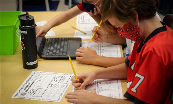 Boy works on Escape Room problems
